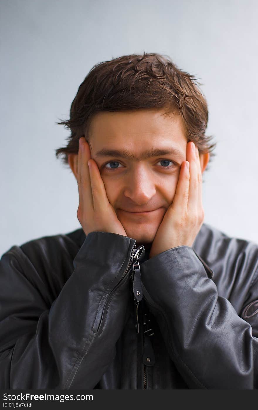 The surprised young man in a black jacket. The surprised young man in a black jacket.