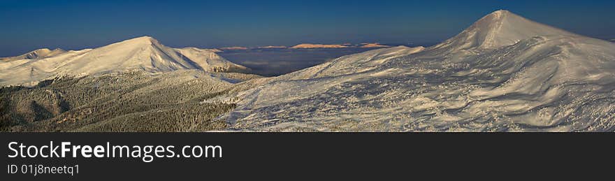 Beautiful panorama of famous Ukrainian mountains Hoverla and Petros in winter. Beautiful panorama of famous Ukrainian mountains Hoverla and Petros in winter