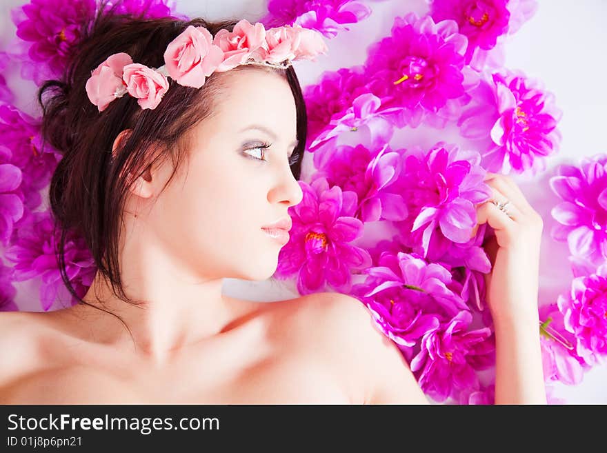 Portrait of attractive woman face with flowers