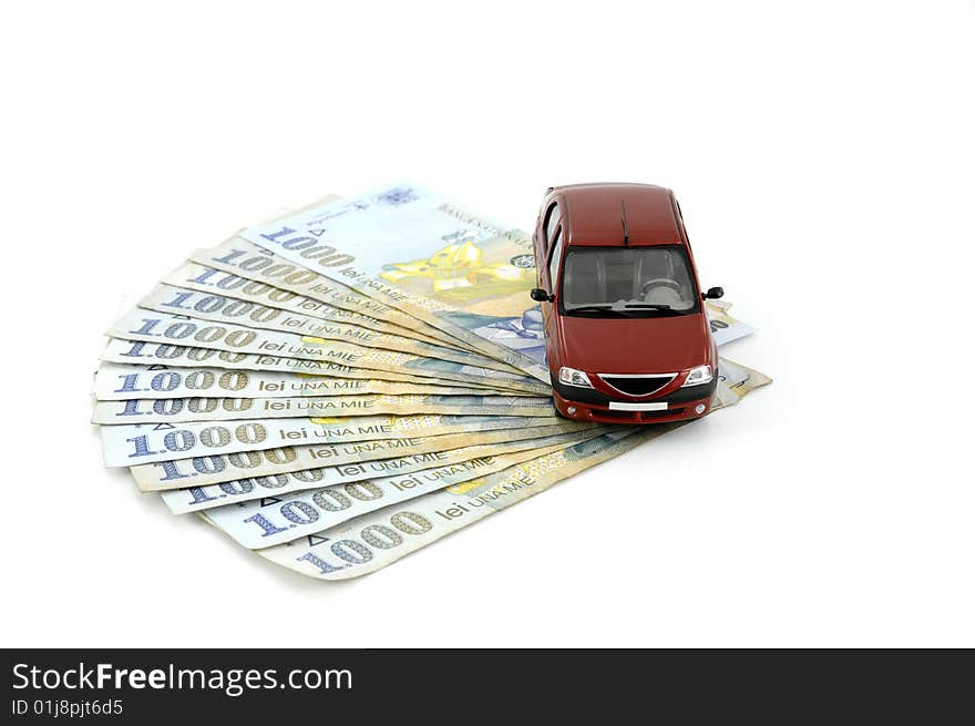 Small car on money against white background. Small car on money against white background