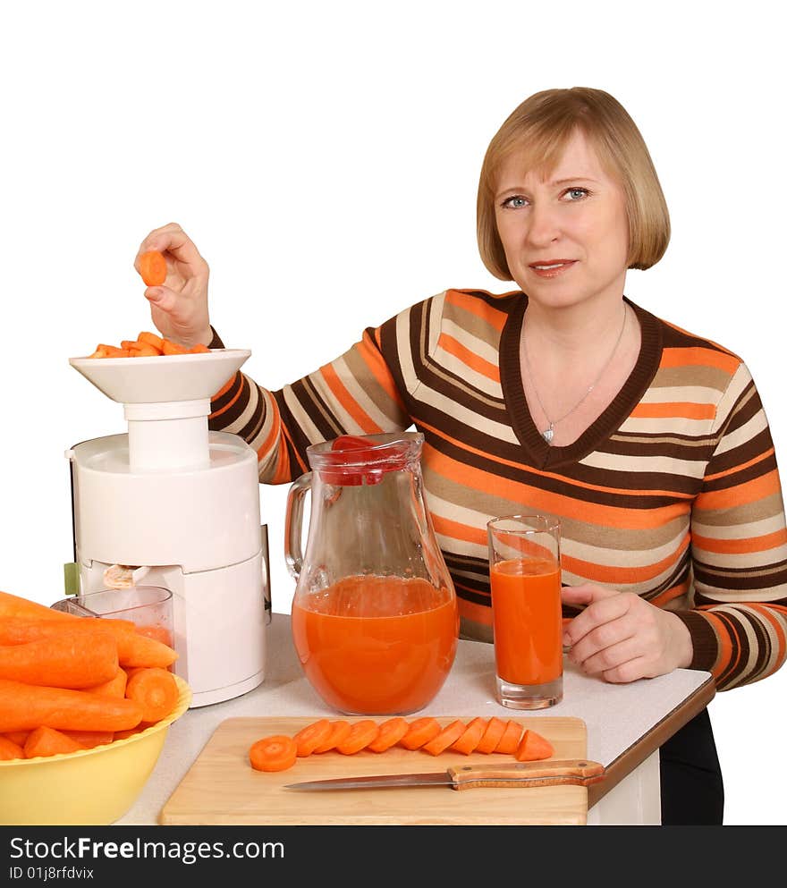 The woman has prepared for juice from carrots. The woman has prepared for juice from carrots