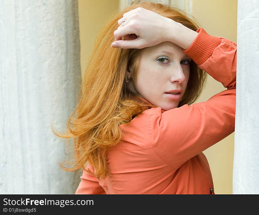 Fashion redheaded girl posing outdoors. Fashion redheaded girl posing outdoors