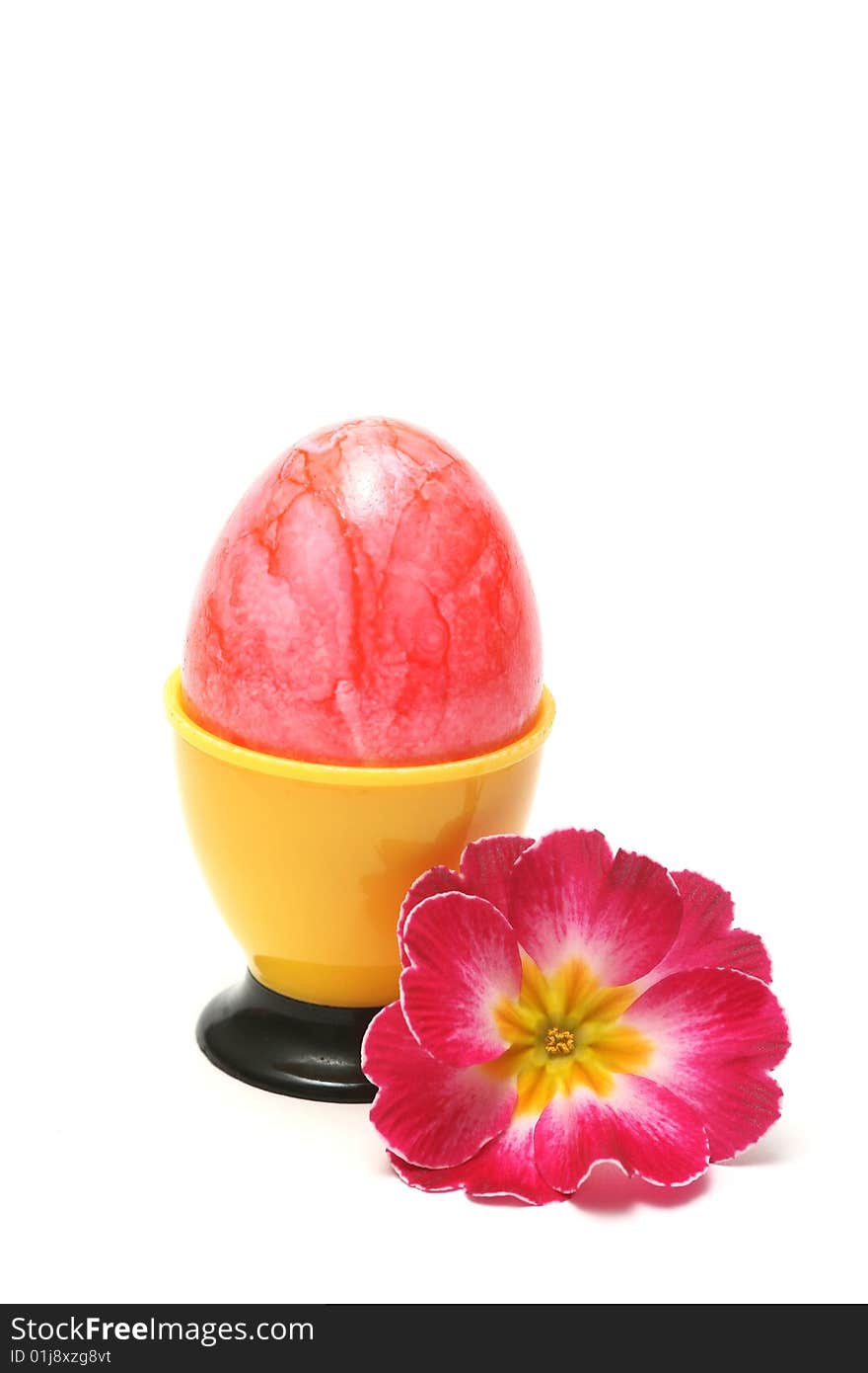 Easter egg with red flower on white background.