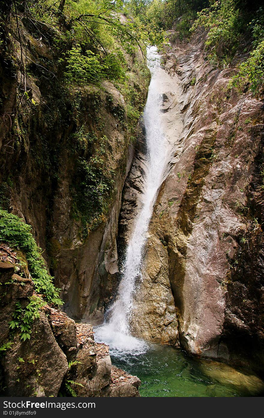 A picture of the scenic beauty of waterfall and transparent pool in Nanling Natural Park in Guangdong Province, China. A picture of the scenic beauty of waterfall and transparent pool in Nanling Natural Park in Guangdong Province, China