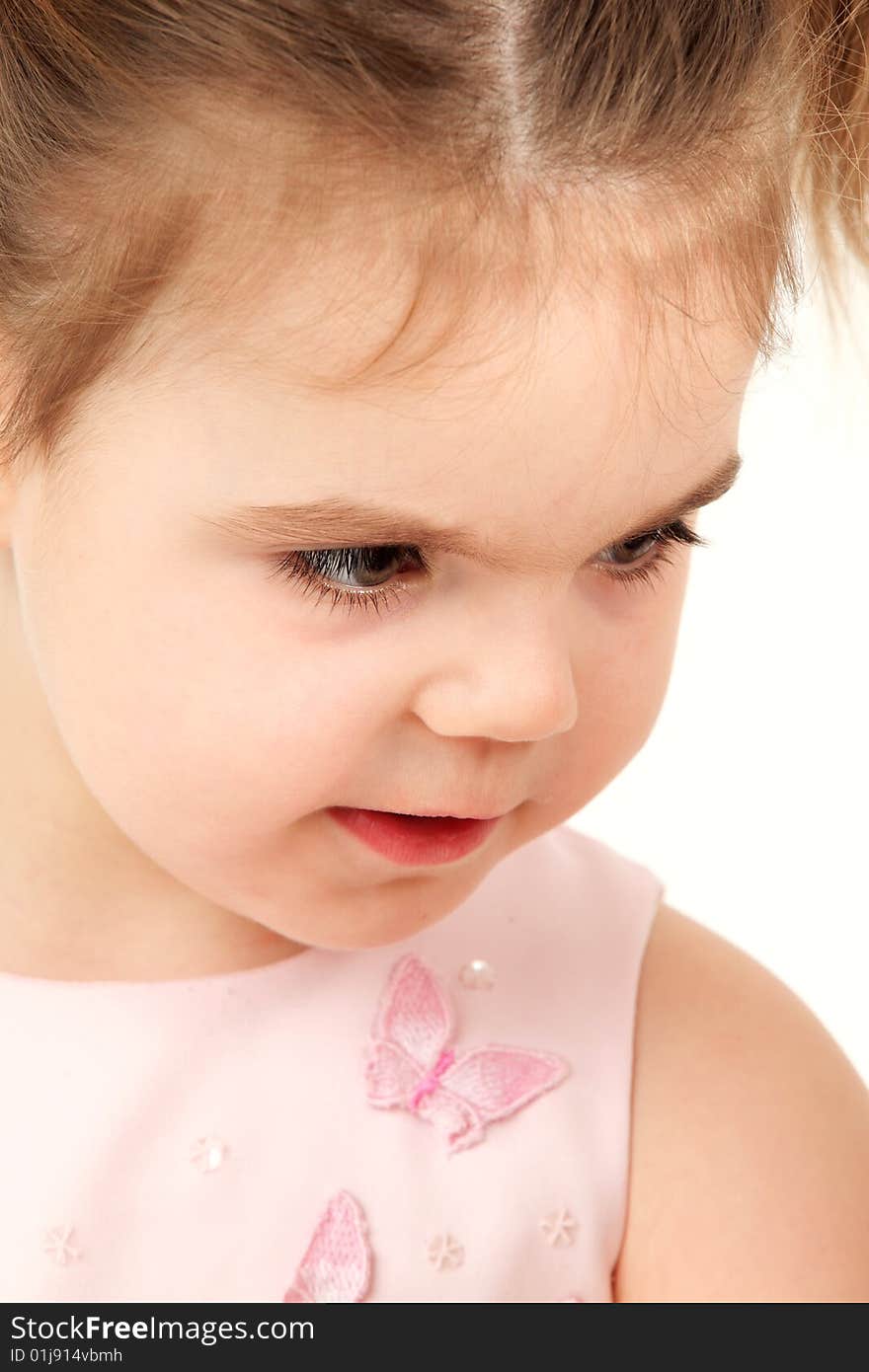 Closeup portrait of a small girl in pink dress. Closeup portrait of a small girl in pink dress