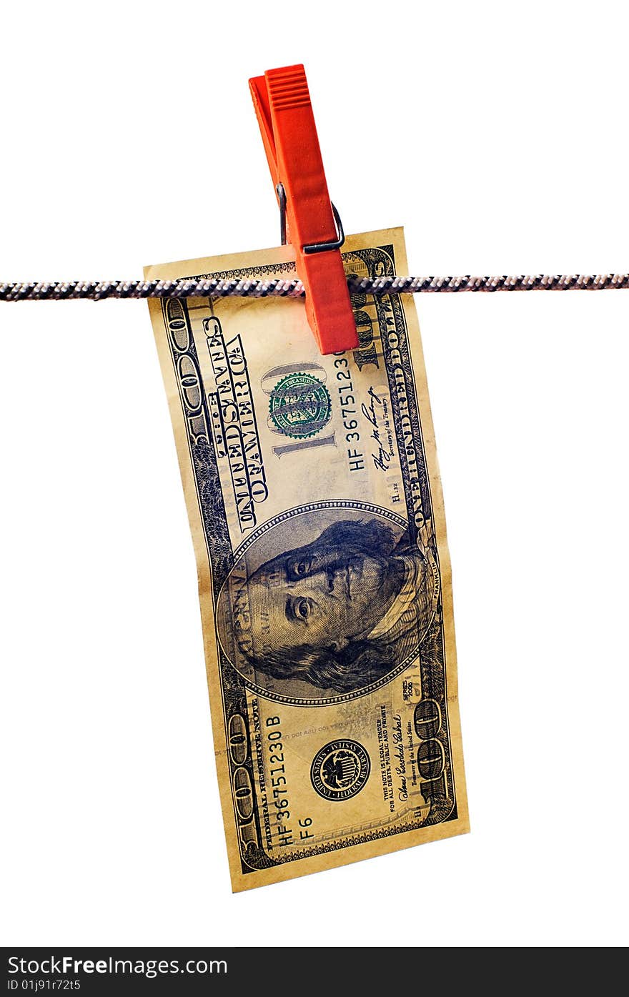 Drying dollar with clothespin on cord on white background