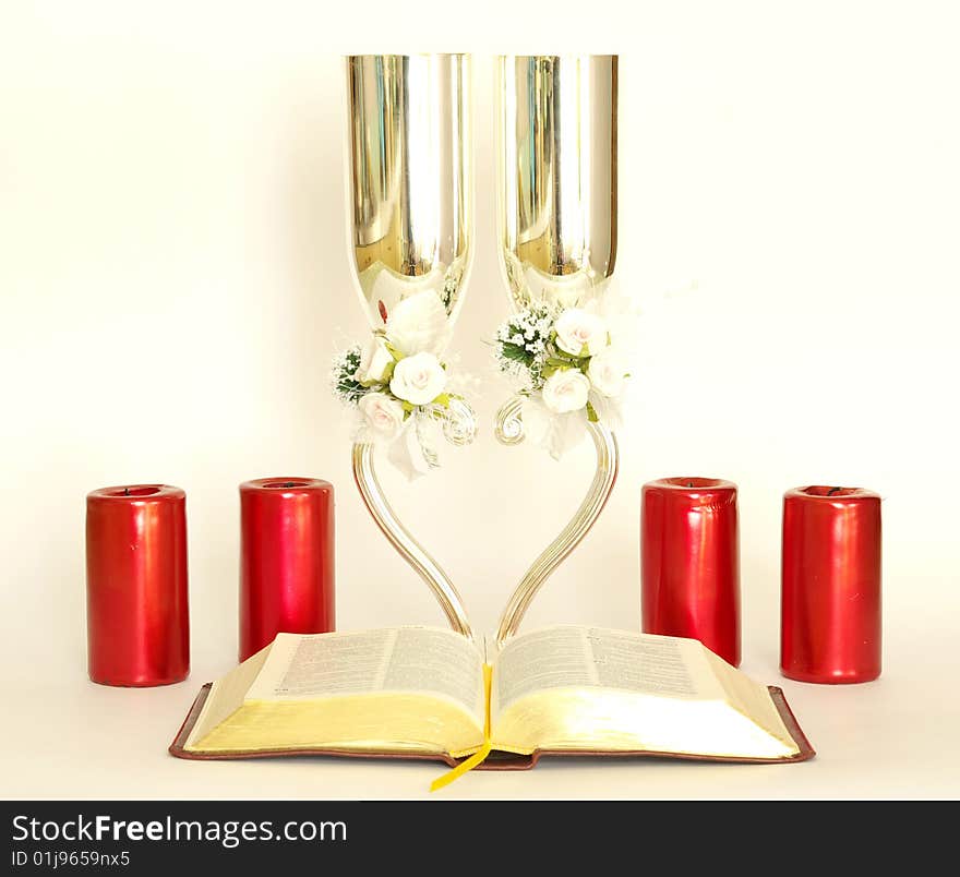 Bible with glasses on a white background