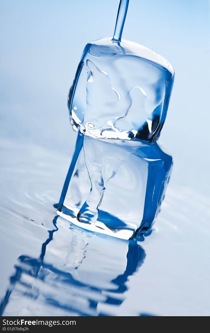 Melting ice cubes toned blue