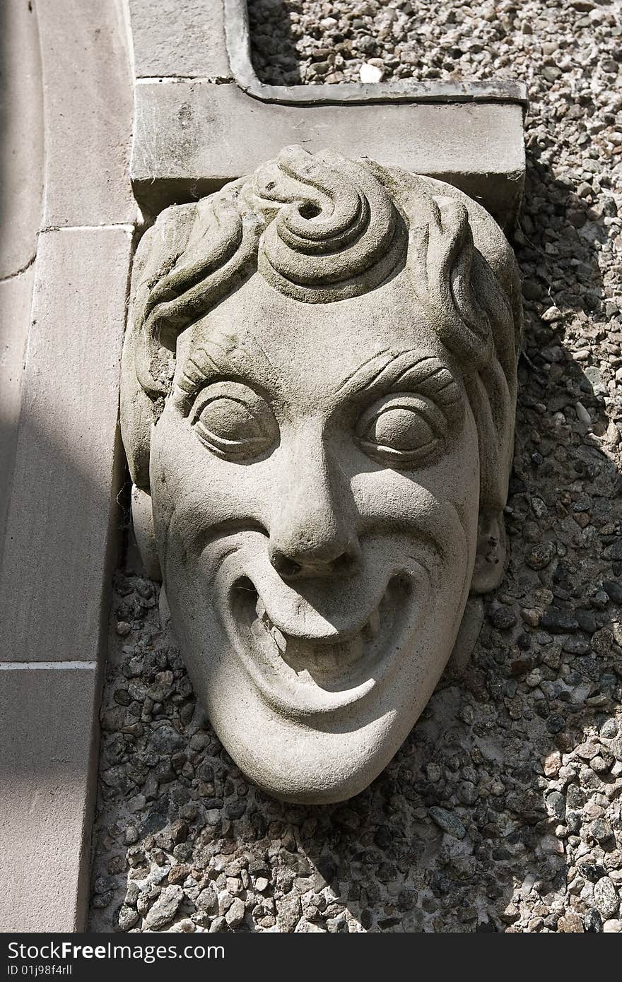 Monotone stone face of an ugly gargoyle. Monotone stone face of an ugly gargoyle