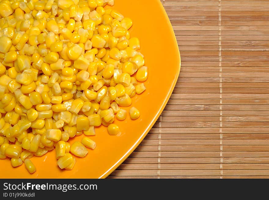 Corn, served on a plate.