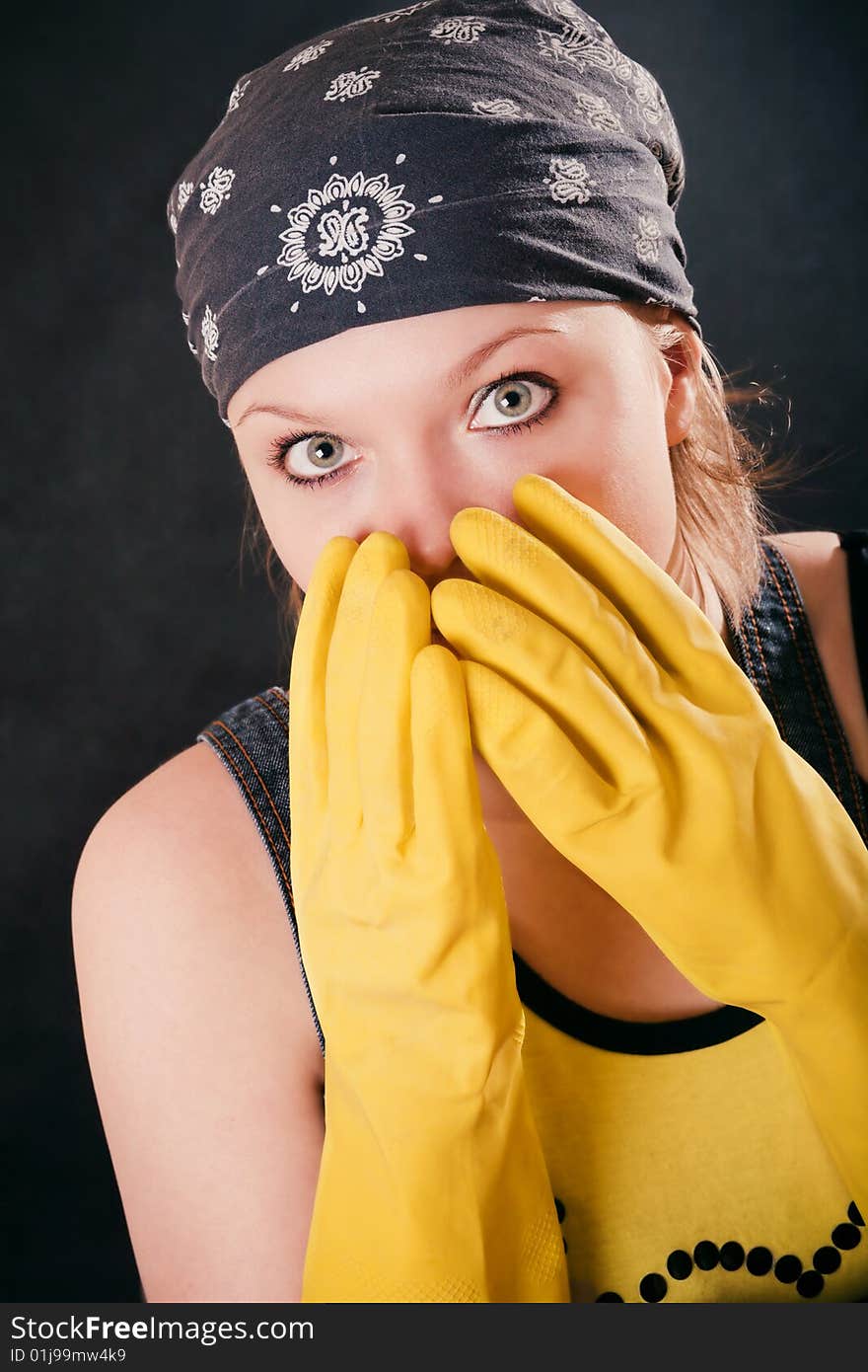 Young woman with yellow gloves