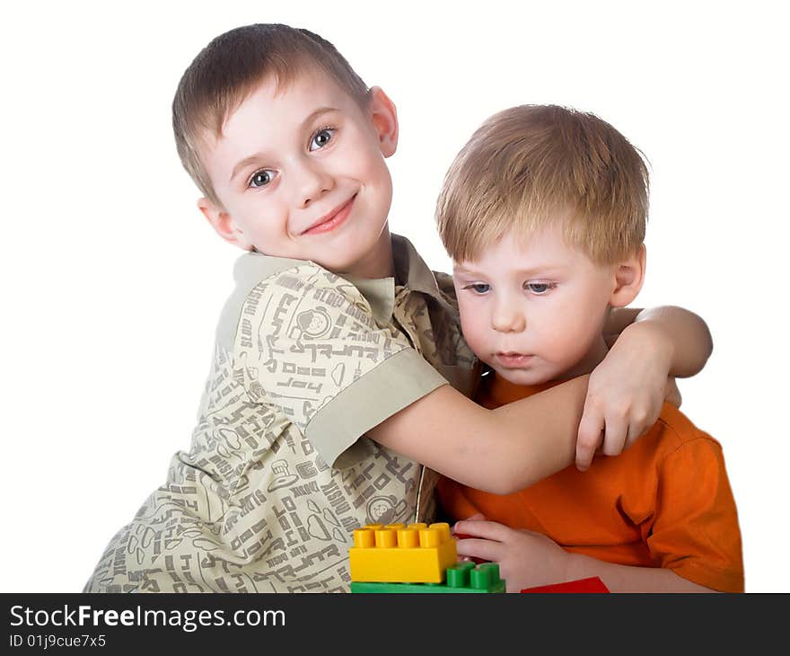 Two boys play on a white background. Two boys play on a white background