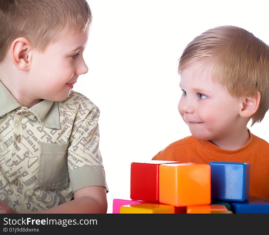 Two boys play on a white background. Two boys play on a white background