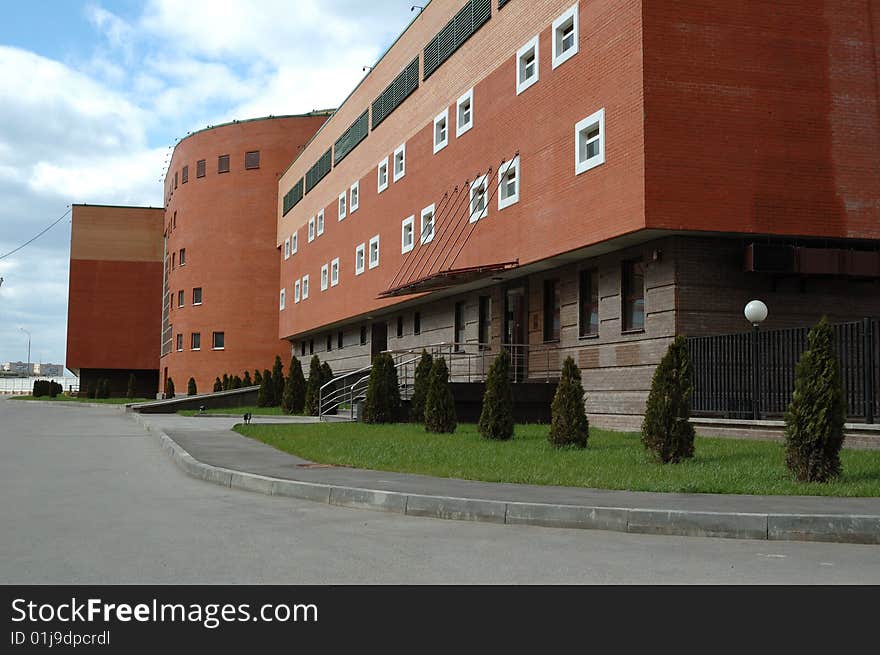 Brick building with a grassy front porches for storage of vehicles. Brick building with a grassy front porches for storage of vehicles