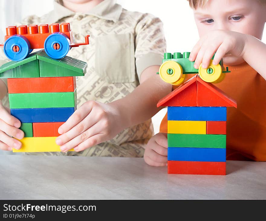 Two boys play on a white background. Two boys play on a white background