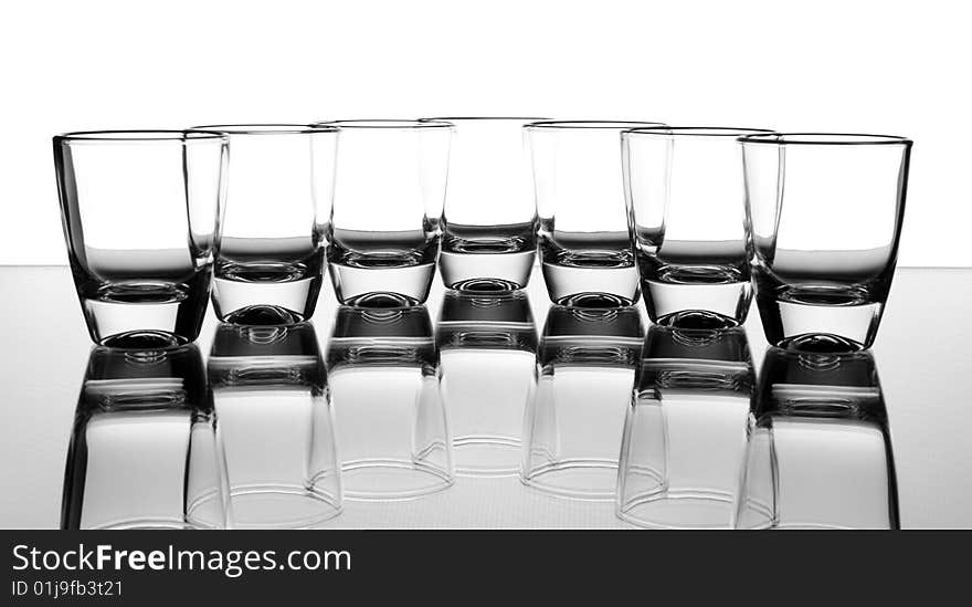 Set of the liquor-glasses on glass surface