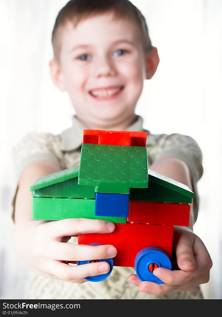 The child the boy plays  on a white background