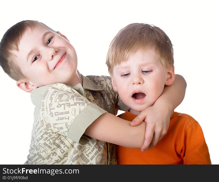 Two boys play on a white background. Two boys play on a white background