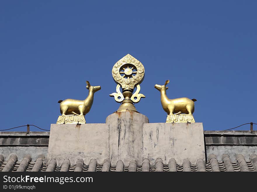 Dharma and double deer on top of temple roof