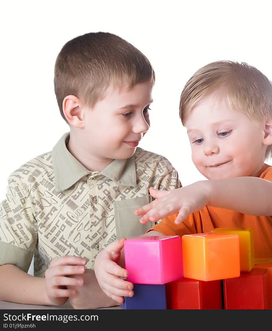 Two boys play on a white background. Two boys play on a white background