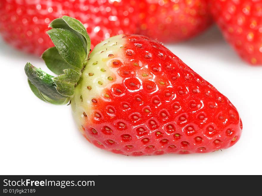 Ripe strawberries on a white background. Ripe strawberries on a white background.