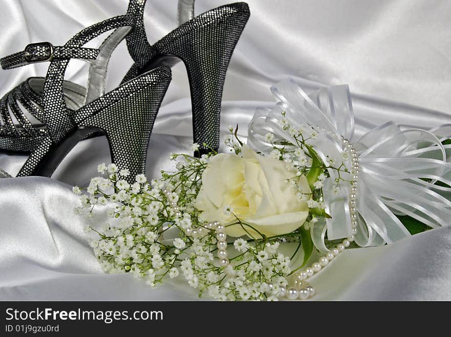 Silver high heels with rose bouquet and pearls. Silver high heels with rose bouquet and pearls.