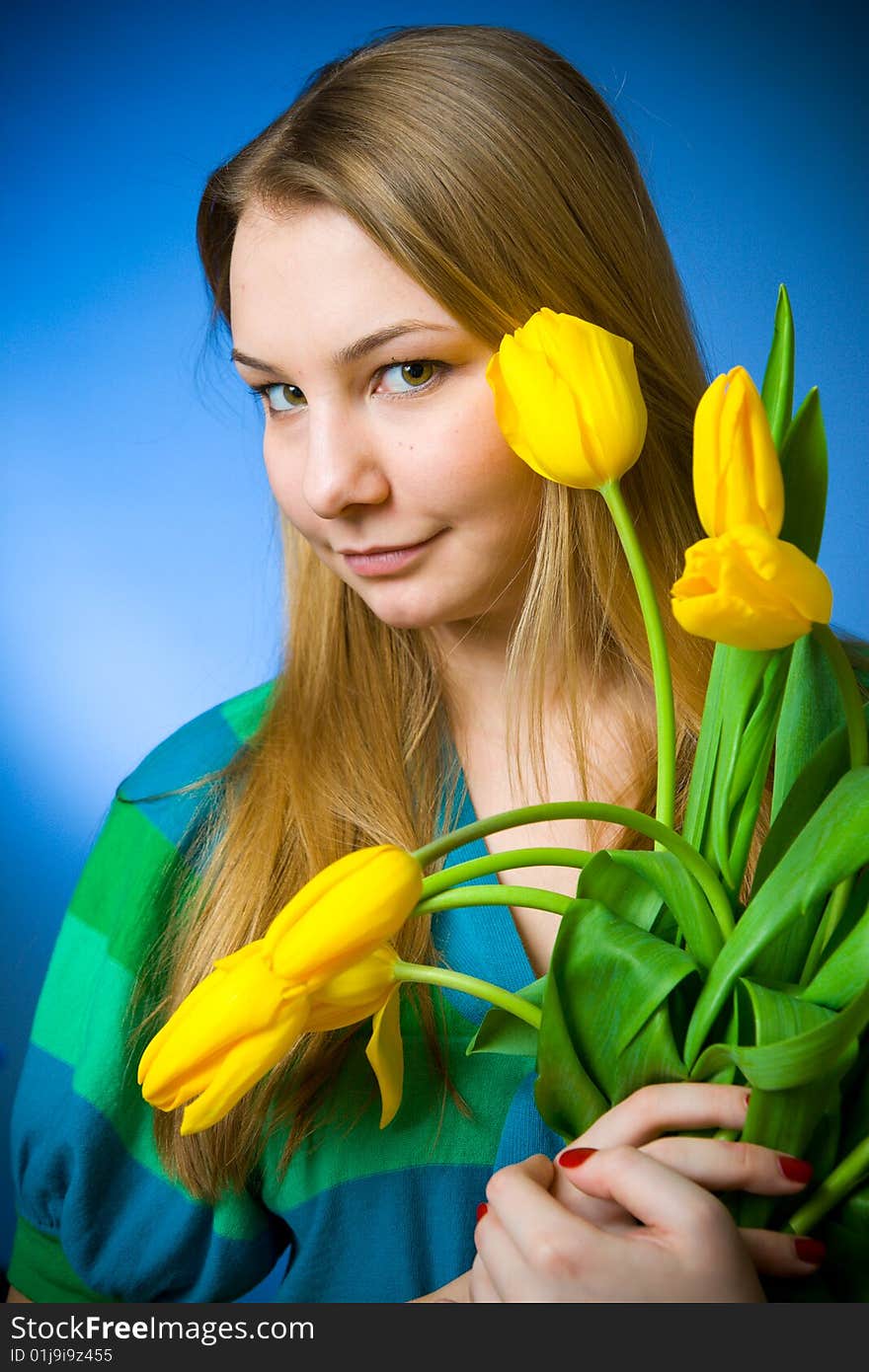 The beautiful girl with tulips