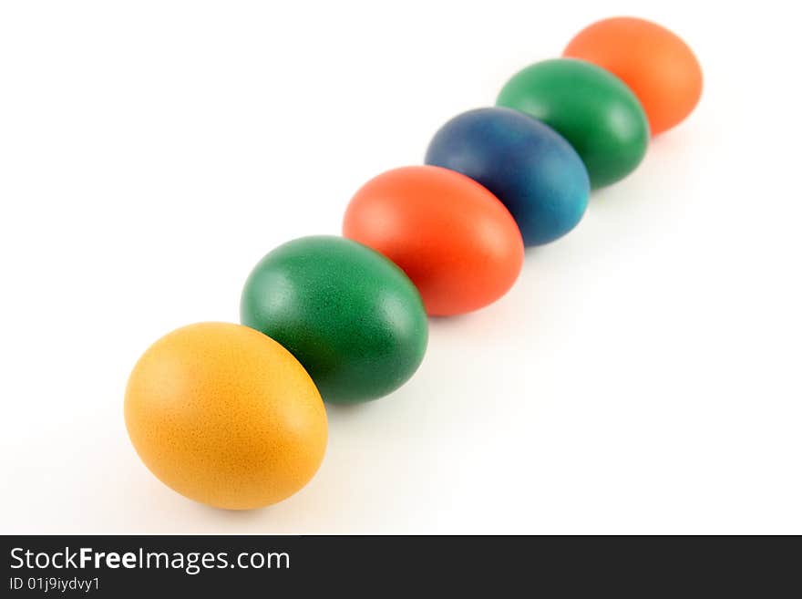 Six colored eggs isolated over white background. Six colored eggs isolated over white background