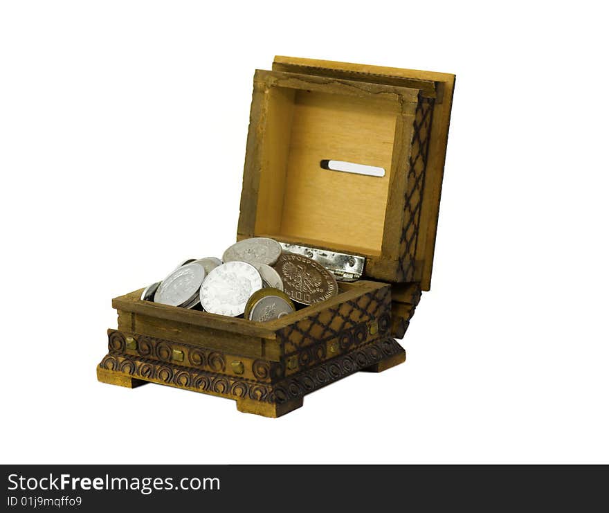 Open wooden vintage moneybox filled with silver shine and dull coins. Open wooden vintage moneybox filled with silver shine and dull coins