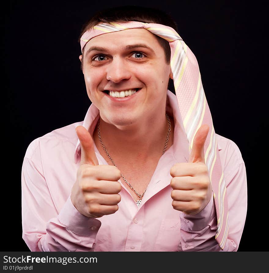 Funny man in pink shirt with necktie on his head