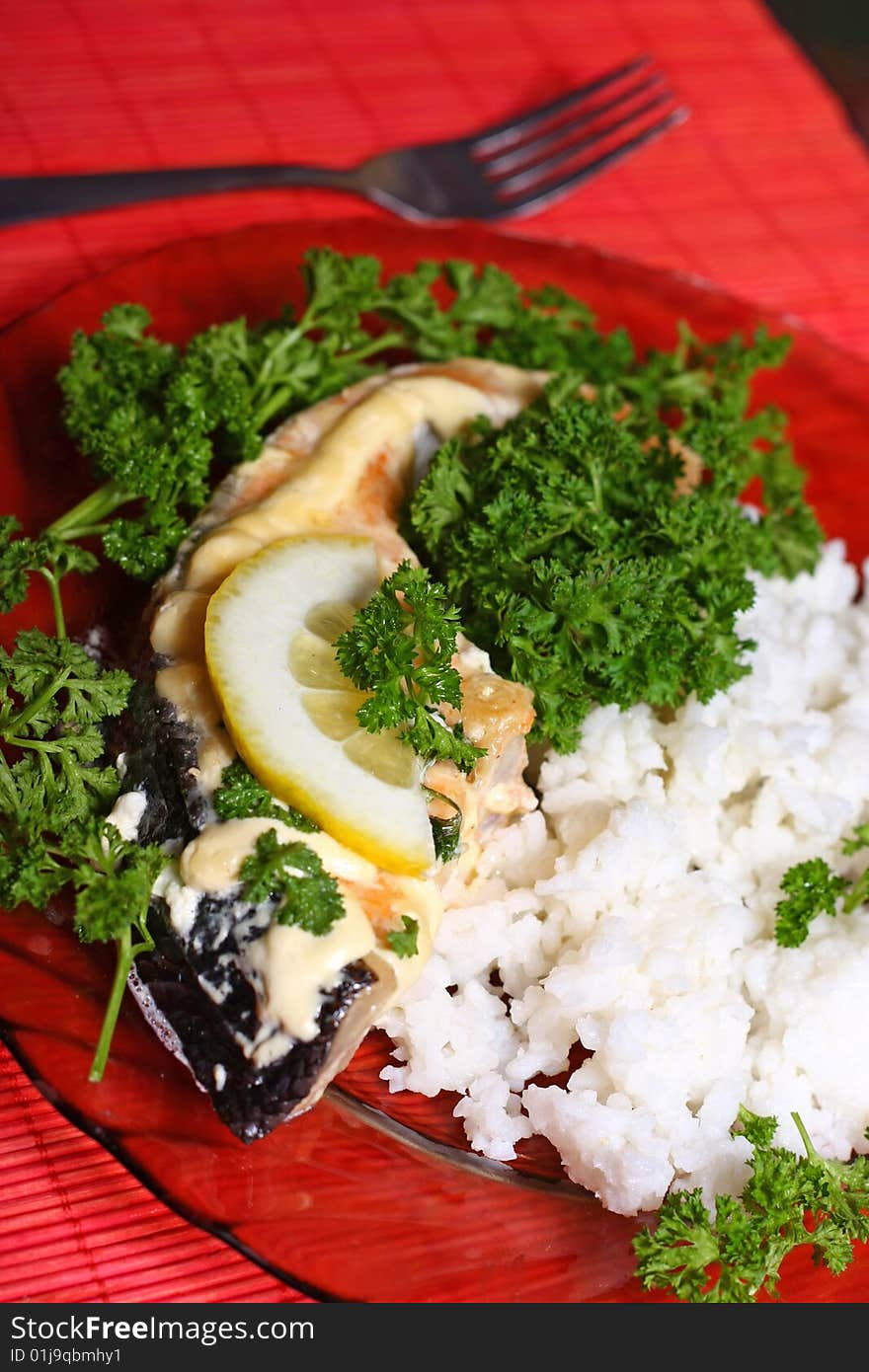 Plate with slice of salmon and rice. Plate with slice of salmon and rice