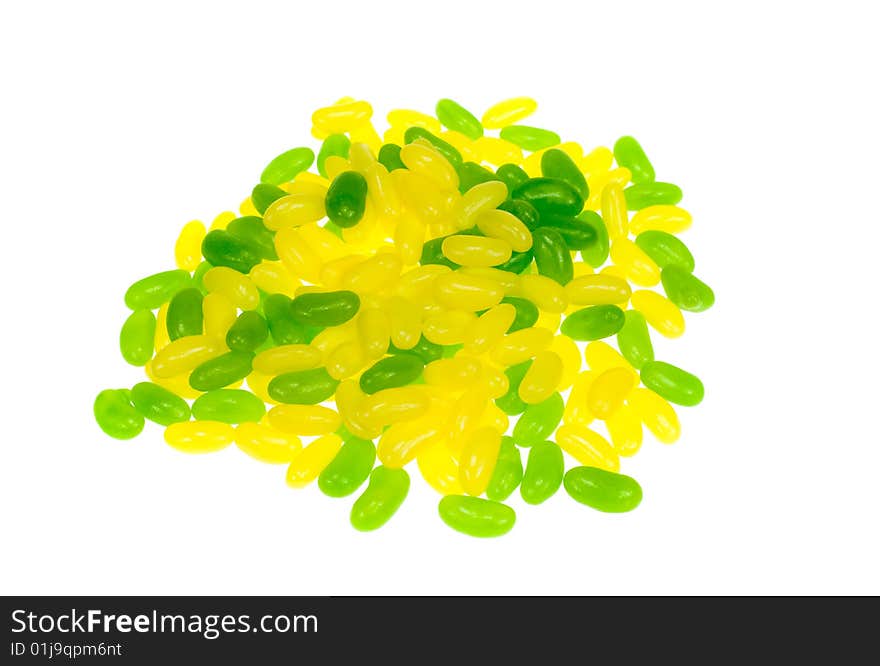 Green and yellow jelly beans isolated on a white background