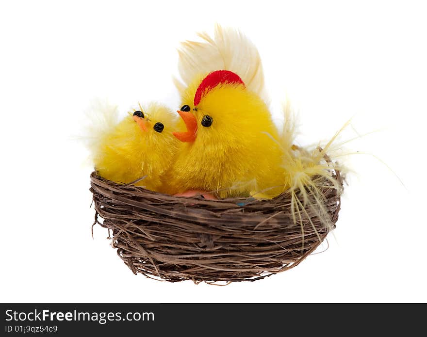 Yellow chicks in a basket isolated on a white background. Yellow chicks in a basket isolated on a white background