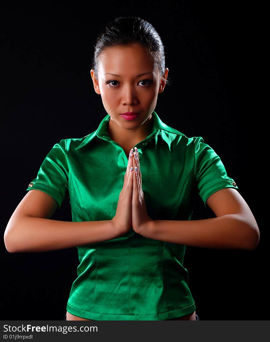 Portrait of a beautiful young woman in green shirt