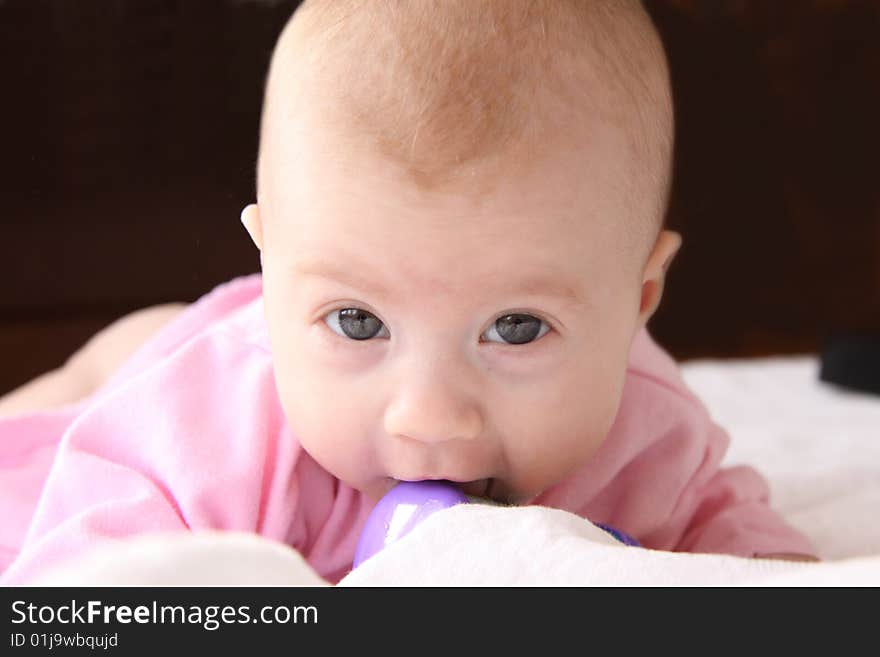 Portrait of cute baby girl with rattle. Portrait of cute baby girl with rattle