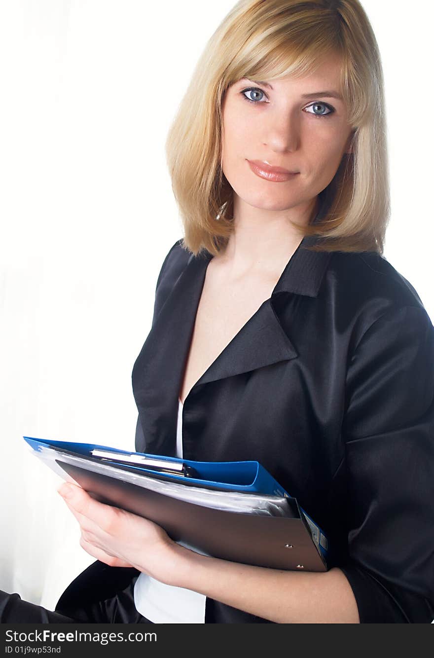 The beautiful businesswoman in a black jacket. The beautiful businesswoman in a black jacket