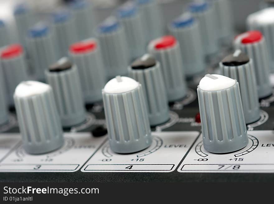 Close-up photo of audio control console