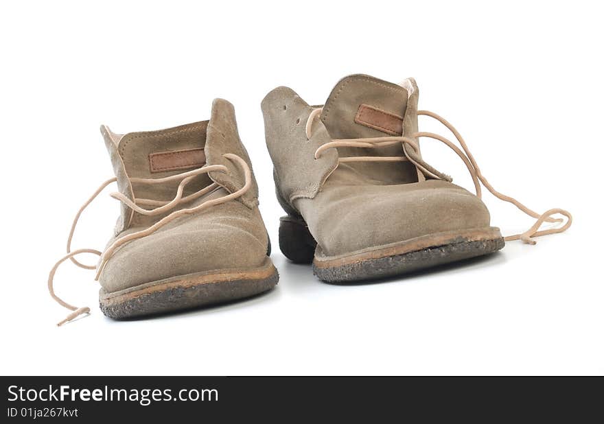 Old worn boots isolated on white background