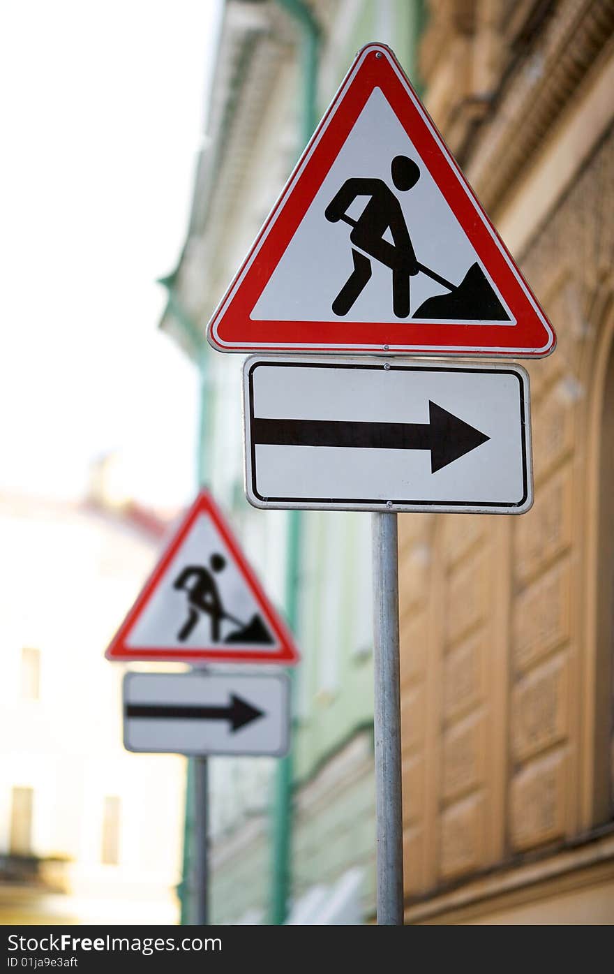 Double sign repair on a roadside. Double sign repair on a roadside.