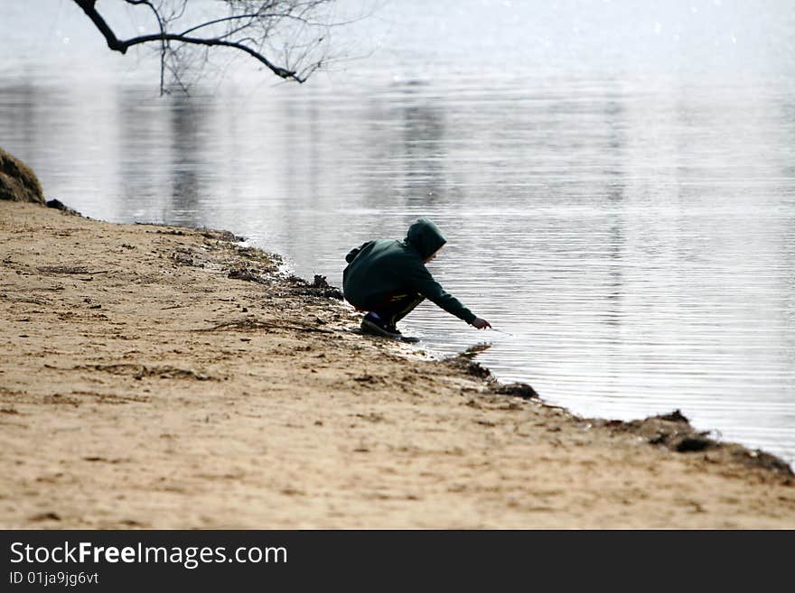 Young boy playing in the water. Young boy playing in the water