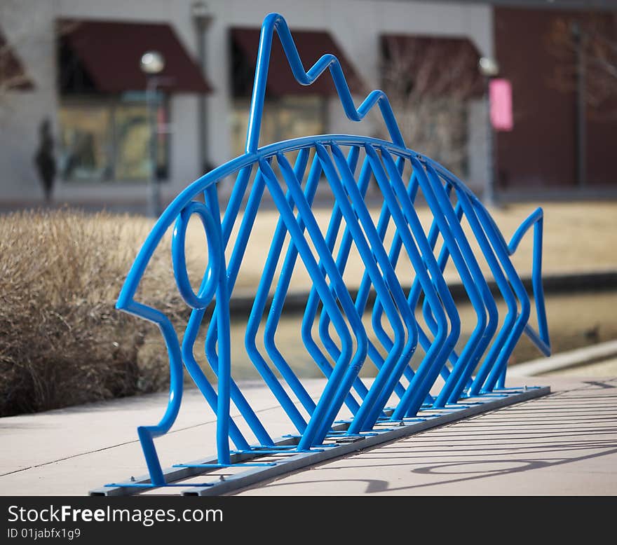 A public bicycle rack or stand designed in the shape of a fish. A public bicycle rack or stand designed in the shape of a fish.