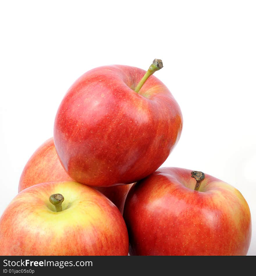 Apples arranged on a white background - staked