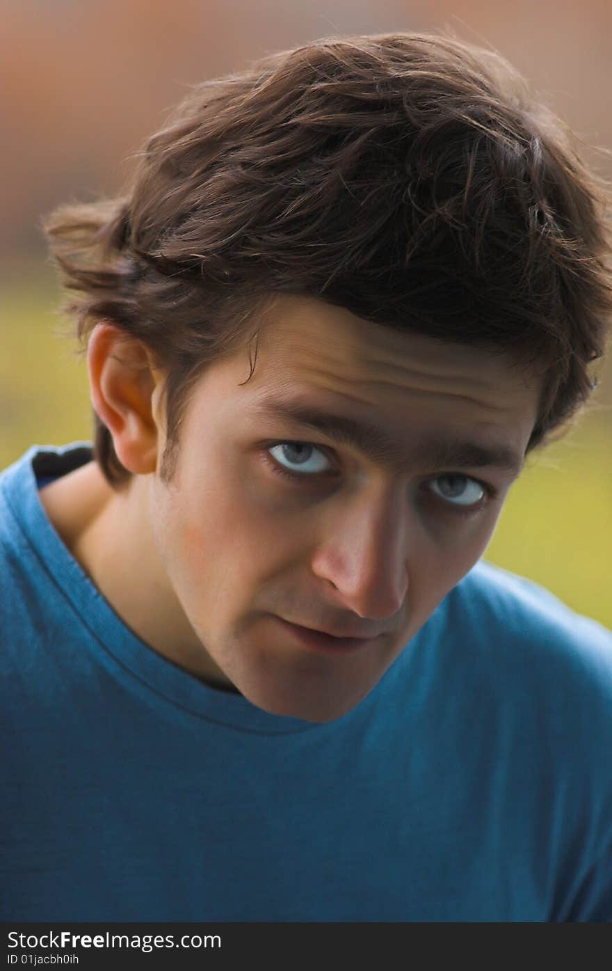 The amazed young man who has wrinkled a forehead, in a blue T-shirt. The amazed young man who has wrinkled a forehead, in a blue T-shirt.