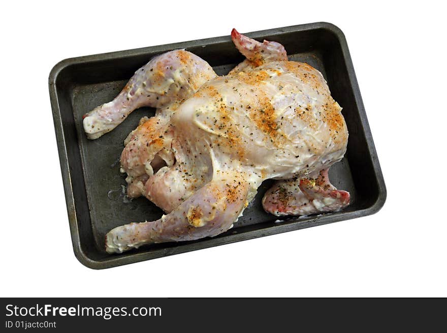 A tray of freshly prepared uncooked chicken. A tray of freshly prepared uncooked chicken