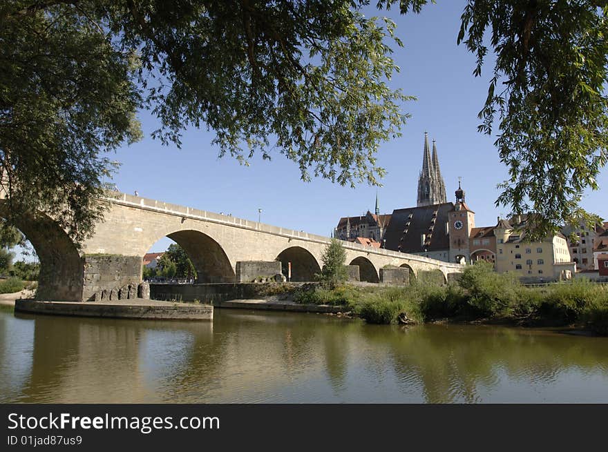 The famous old bridge and cathedral of Regensburg in Germany. The famous old bridge and cathedral of Regensburg in Germany