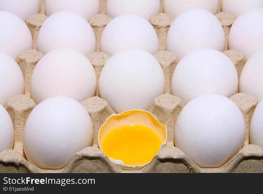 Much white raw eggs and yolk on tray. Much white raw eggs and yolk on tray