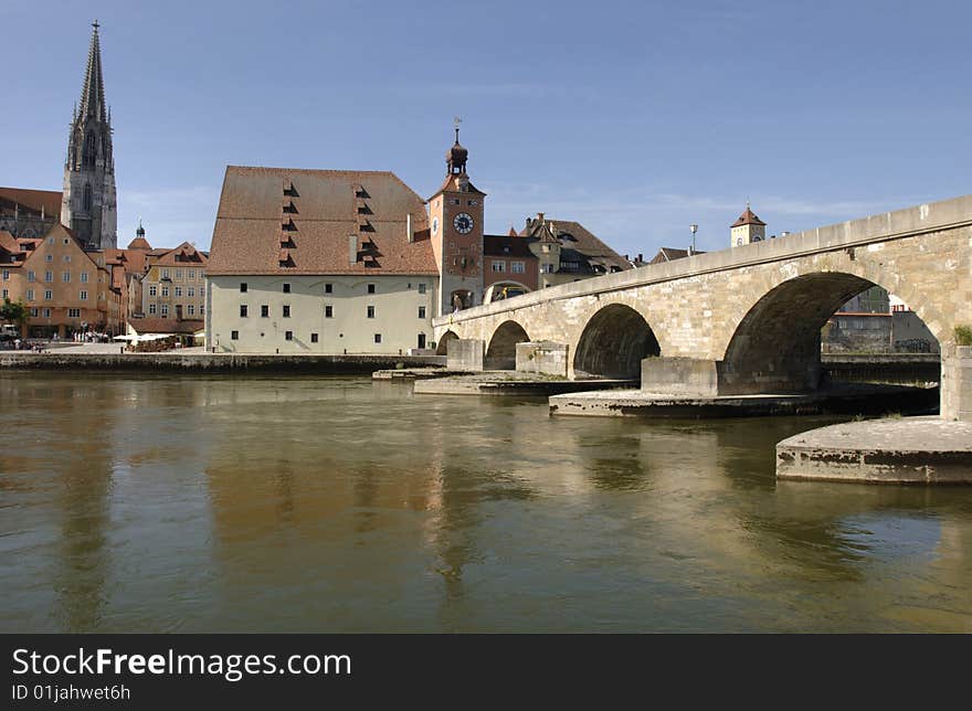 The famous old bridge and cathedral of Regensburg in Germany. The famous old bridge and cathedral of Regensburg in Germany