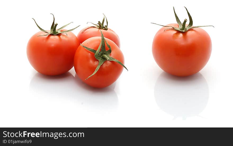 A group of tomatoes isolated on white background