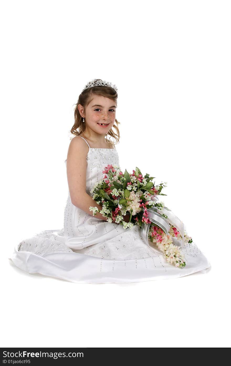 Pretty girl in white gown and tiara