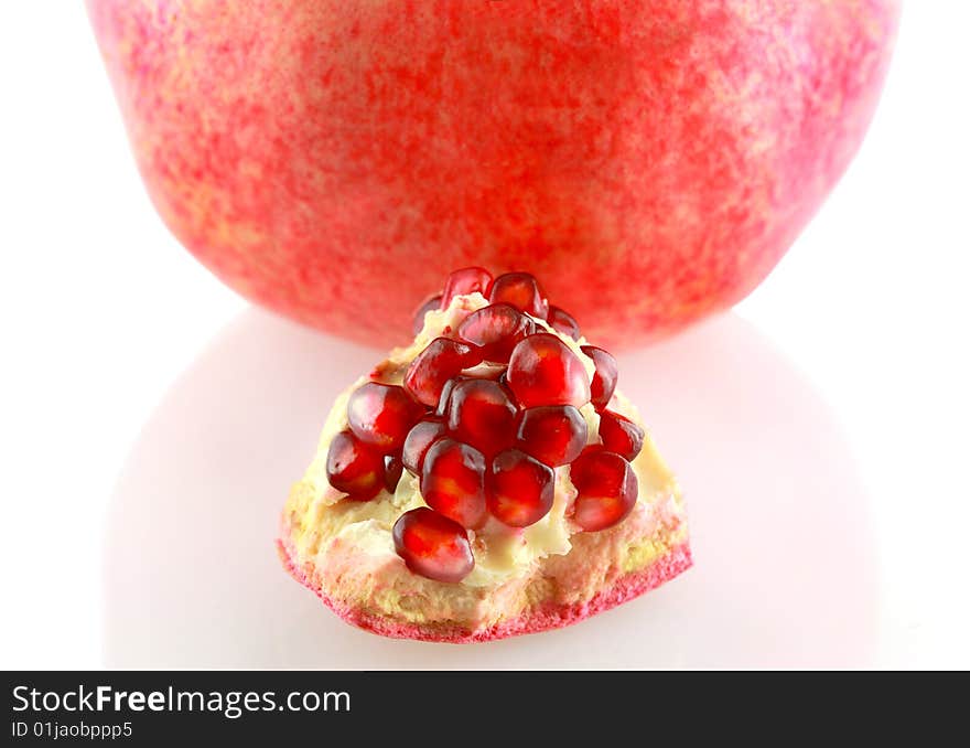 Piece of pomegranate isolated on white